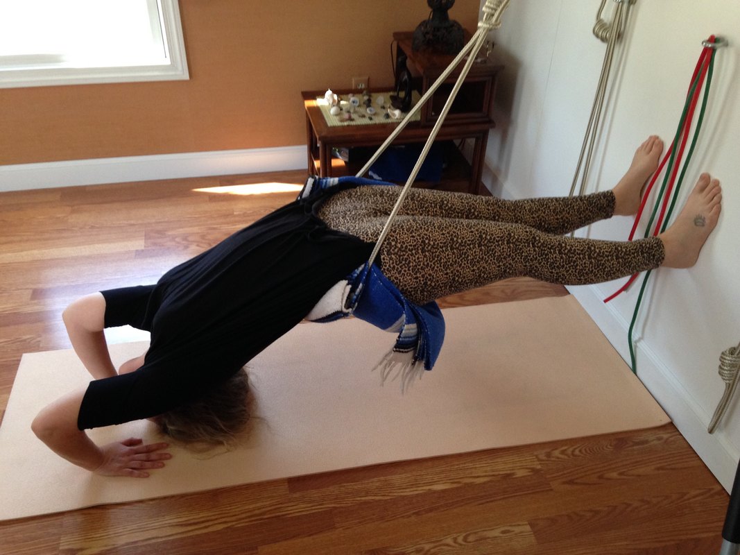 therapeutic yoga on rope wall